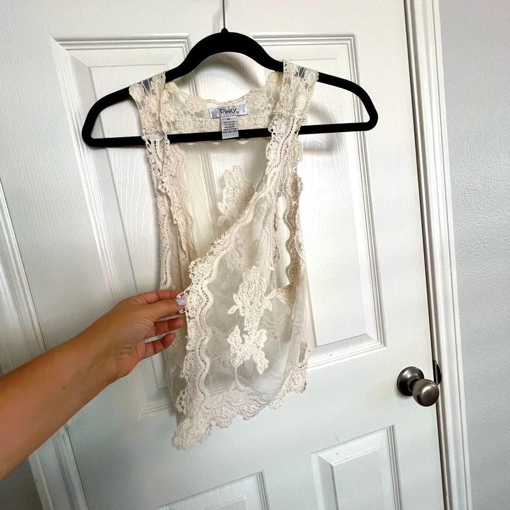 Lacy cream vest.